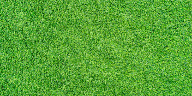 Flat green artificial grass texture or background.